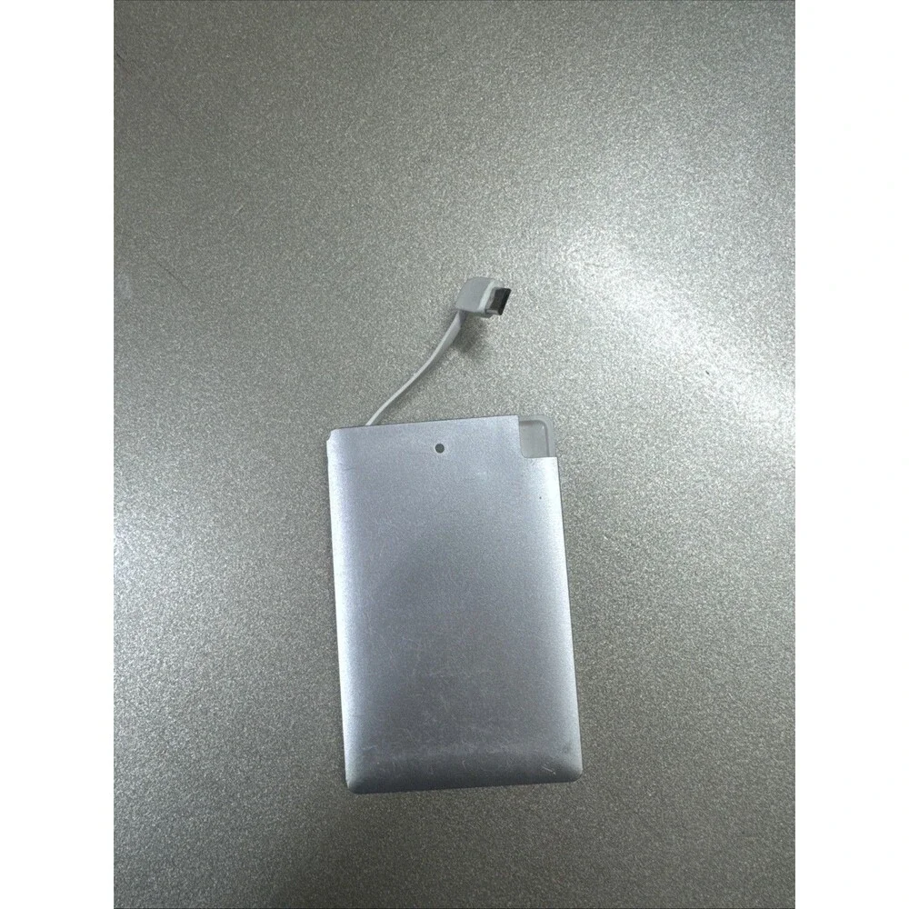 Ultra Slim portable charger silver with looks like Micro-USB cord see photos